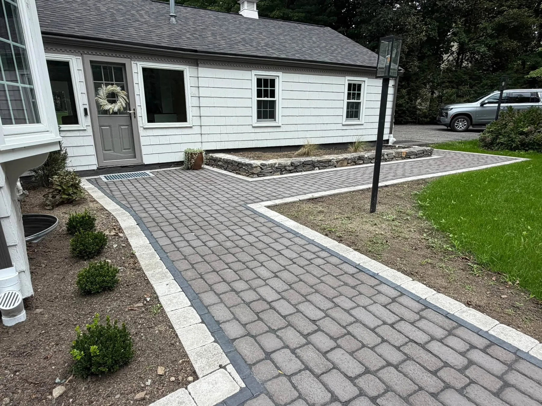 Walkway edge and planting bed at Shrewsbury home
