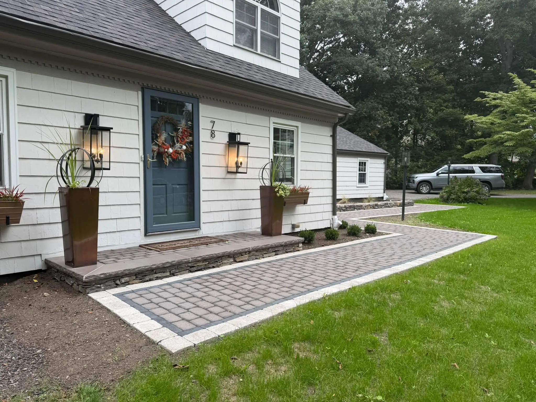 Formal front entry with detailed paver walkway