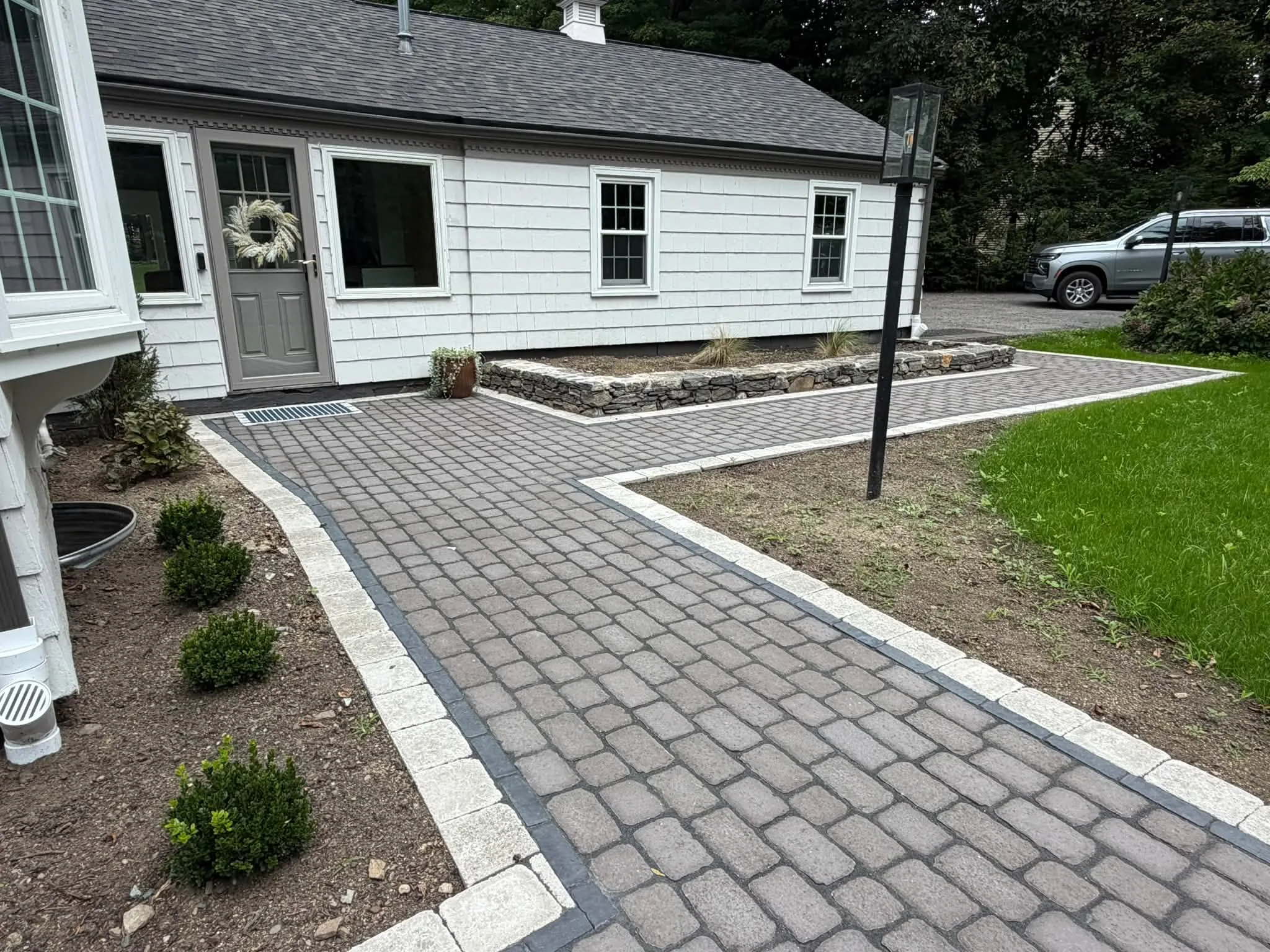 Paver walkway with contrasting borders from a near angle
